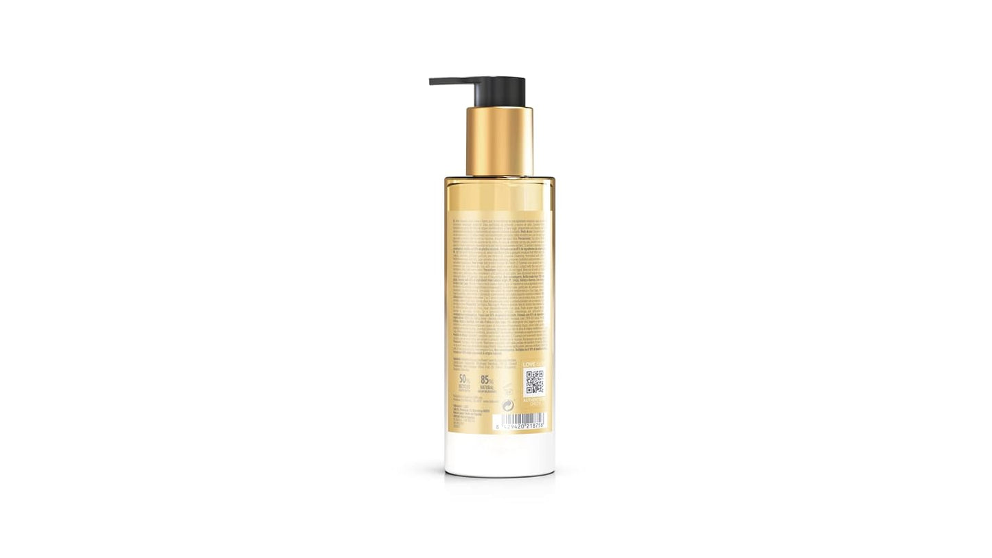 Gold bottle with pump on a white background