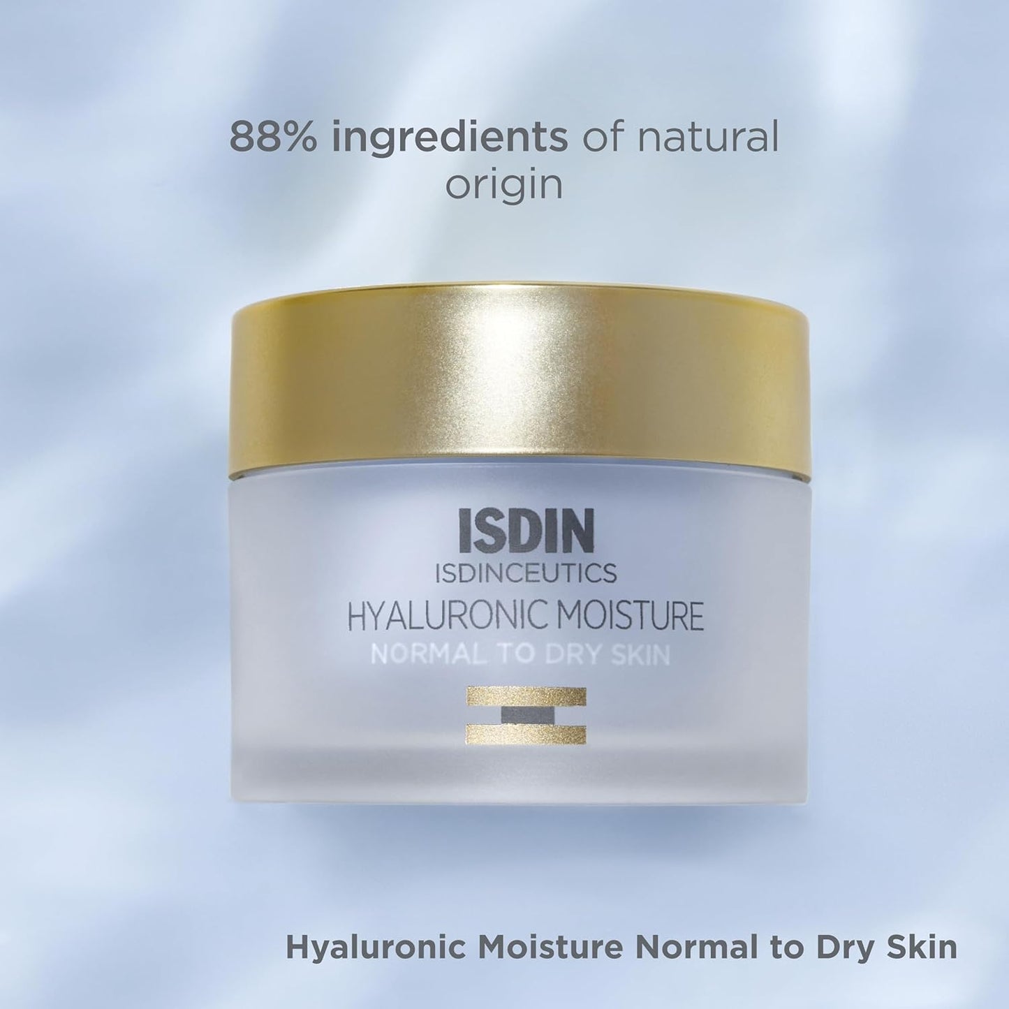 ISDIN cream jar with gold lid on a light blue background