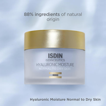 ISDIN cream jar with gold lid on a light blue background