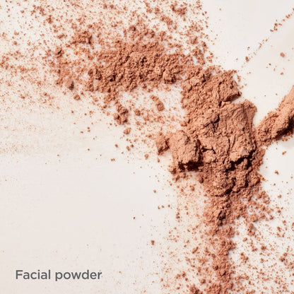Close-up of brown facial powder on a light background