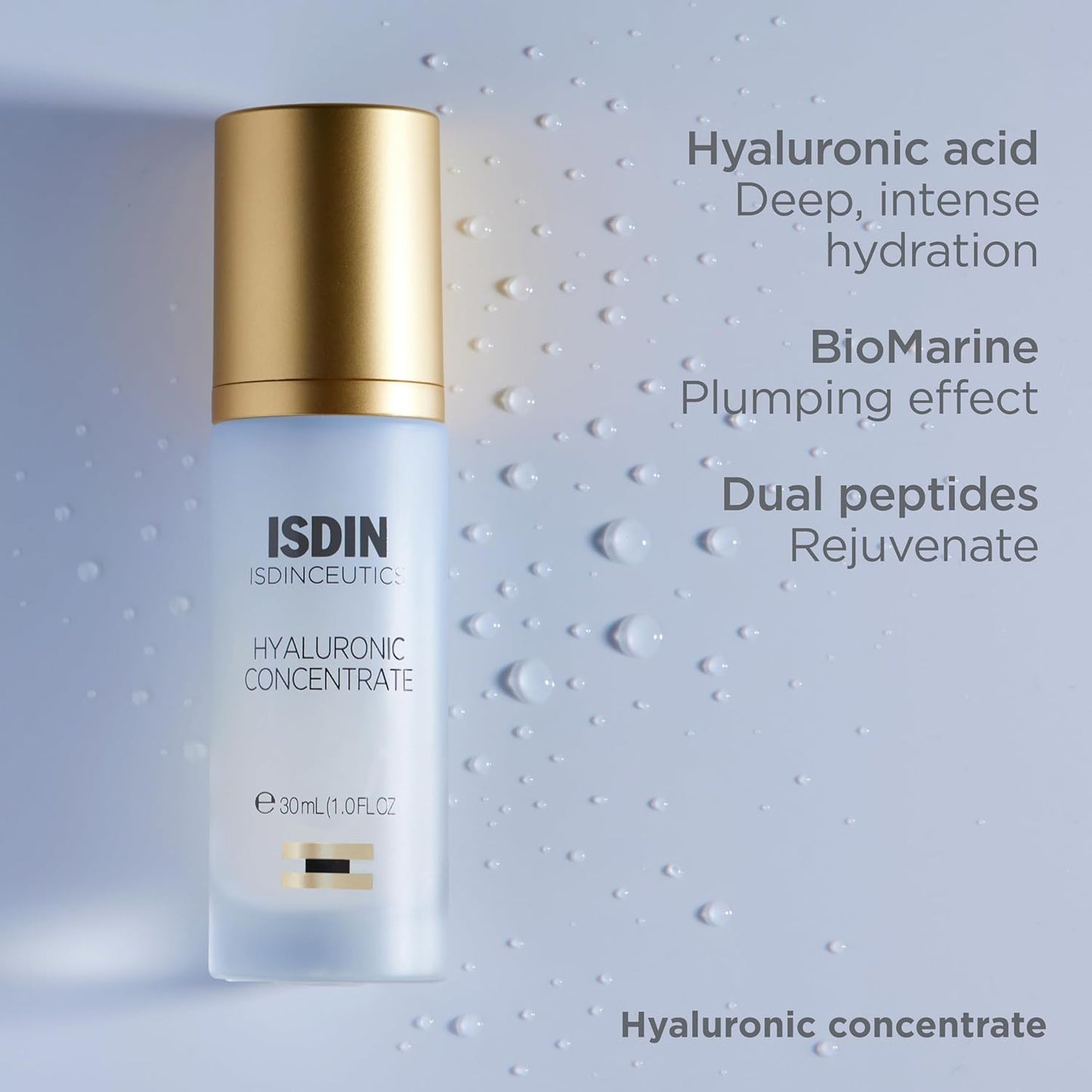 ISDIN skincare bottle with gold cap on a textured gray background