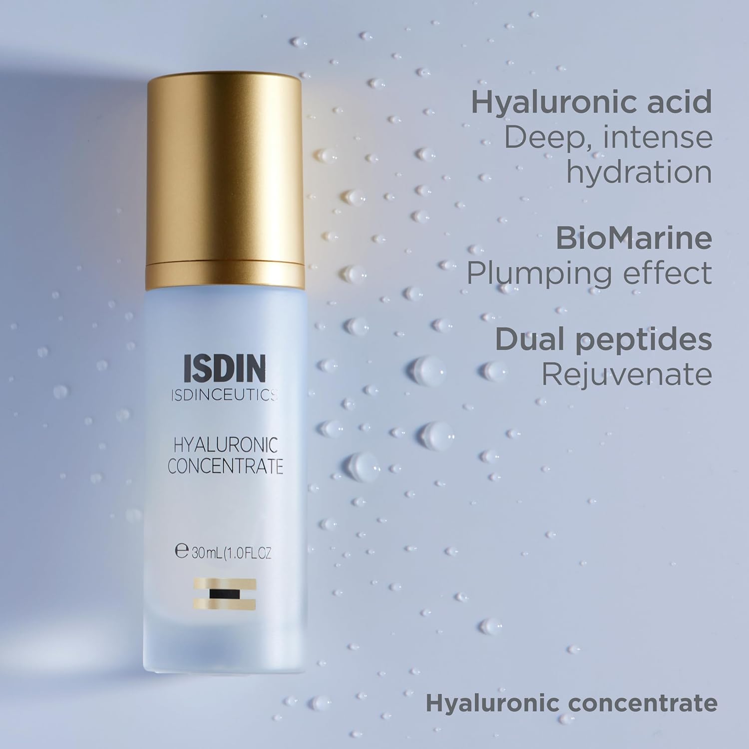 ISDIN skincare bottle with gold cap on a textured gray background