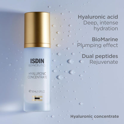 ISDIN skincare bottle with gold cap on a textured gray background
