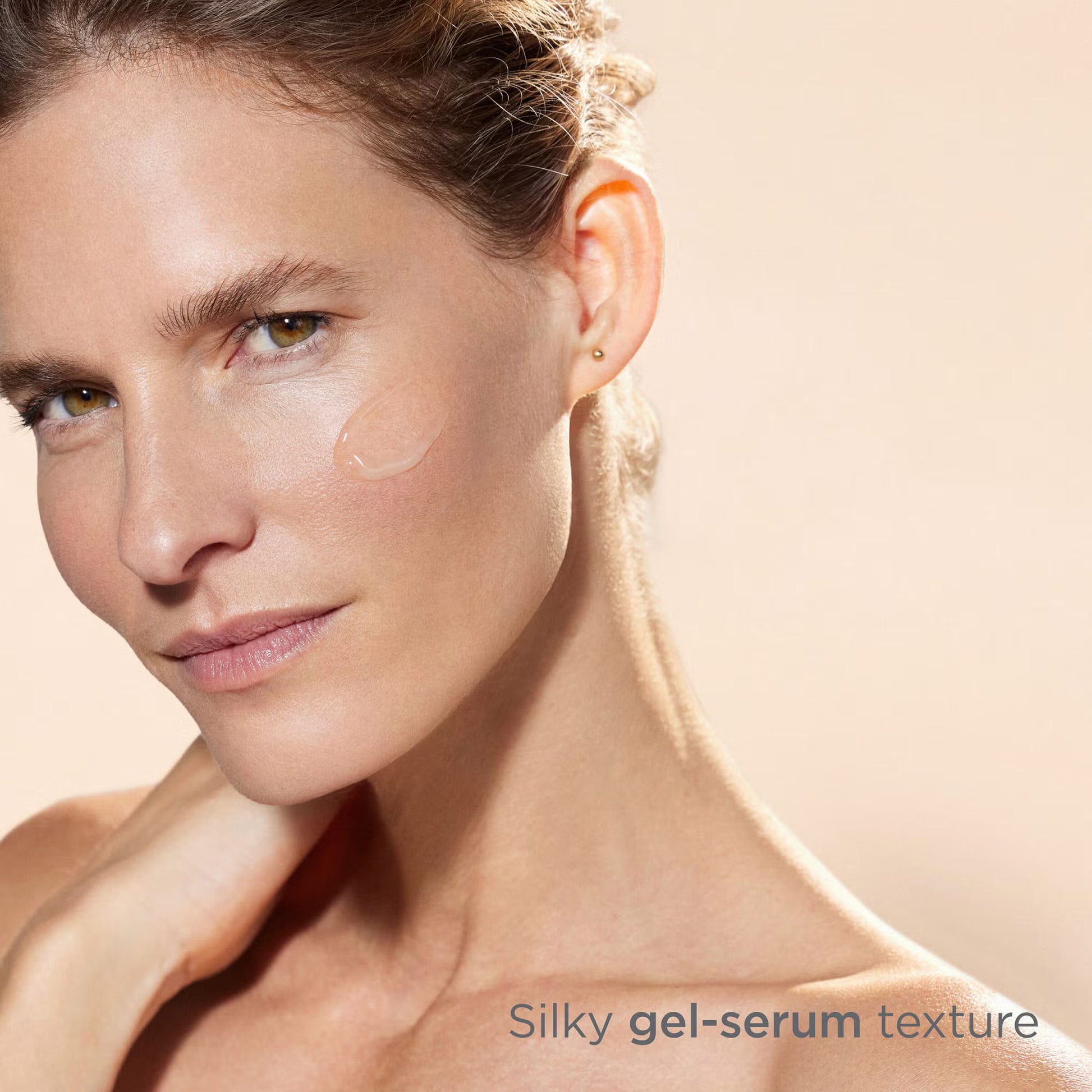 Woman with a smooth neck and shoulders, showcasing a silky gel-serum texture.
