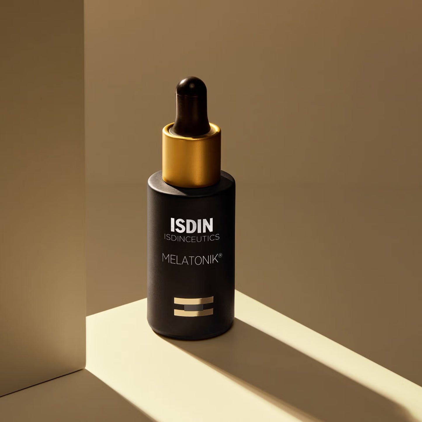 ISDIN Melatonik skincare dropper bottle on a beige background