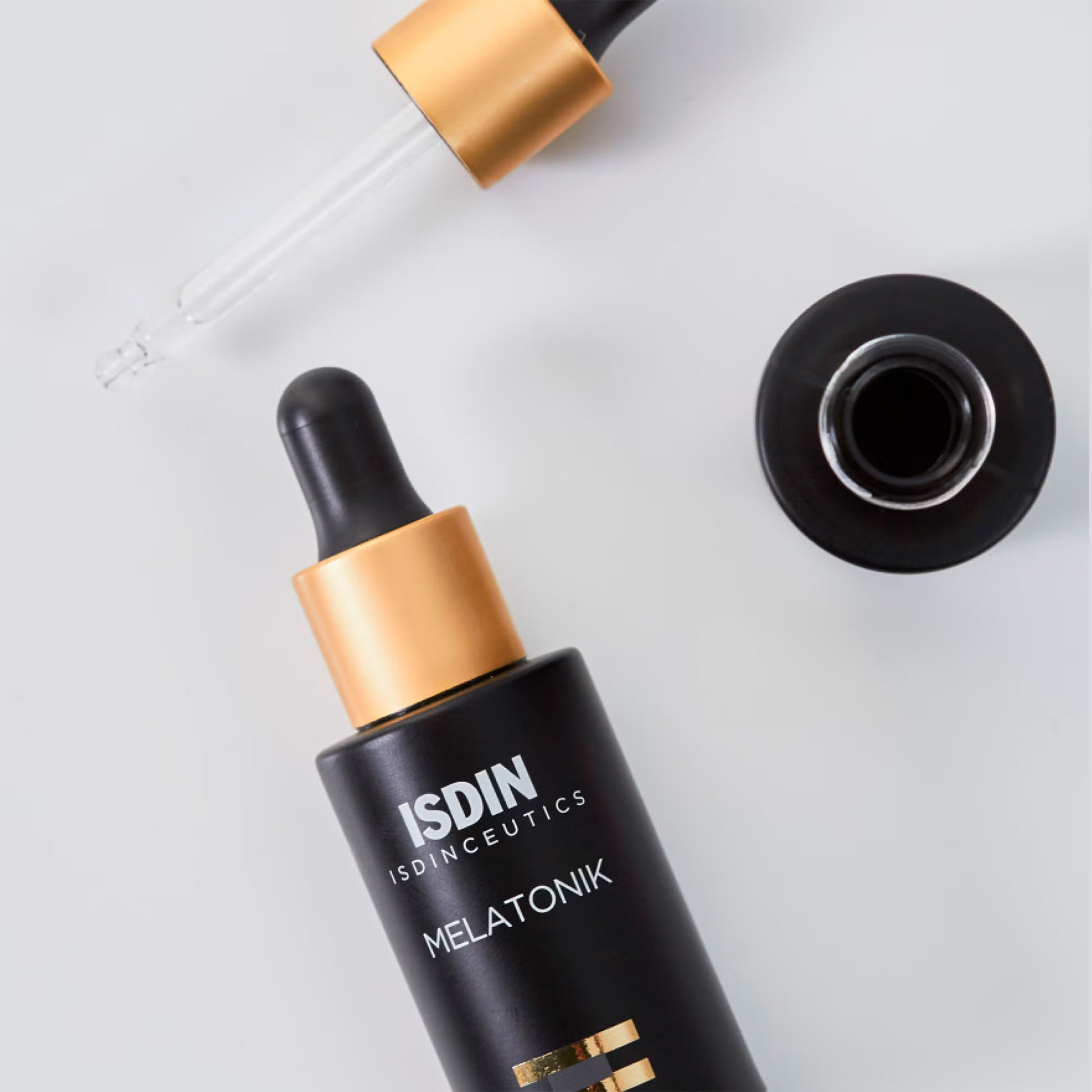 ISDIN Ceuticals Melatonik skincare dropper bottle on a light gray background