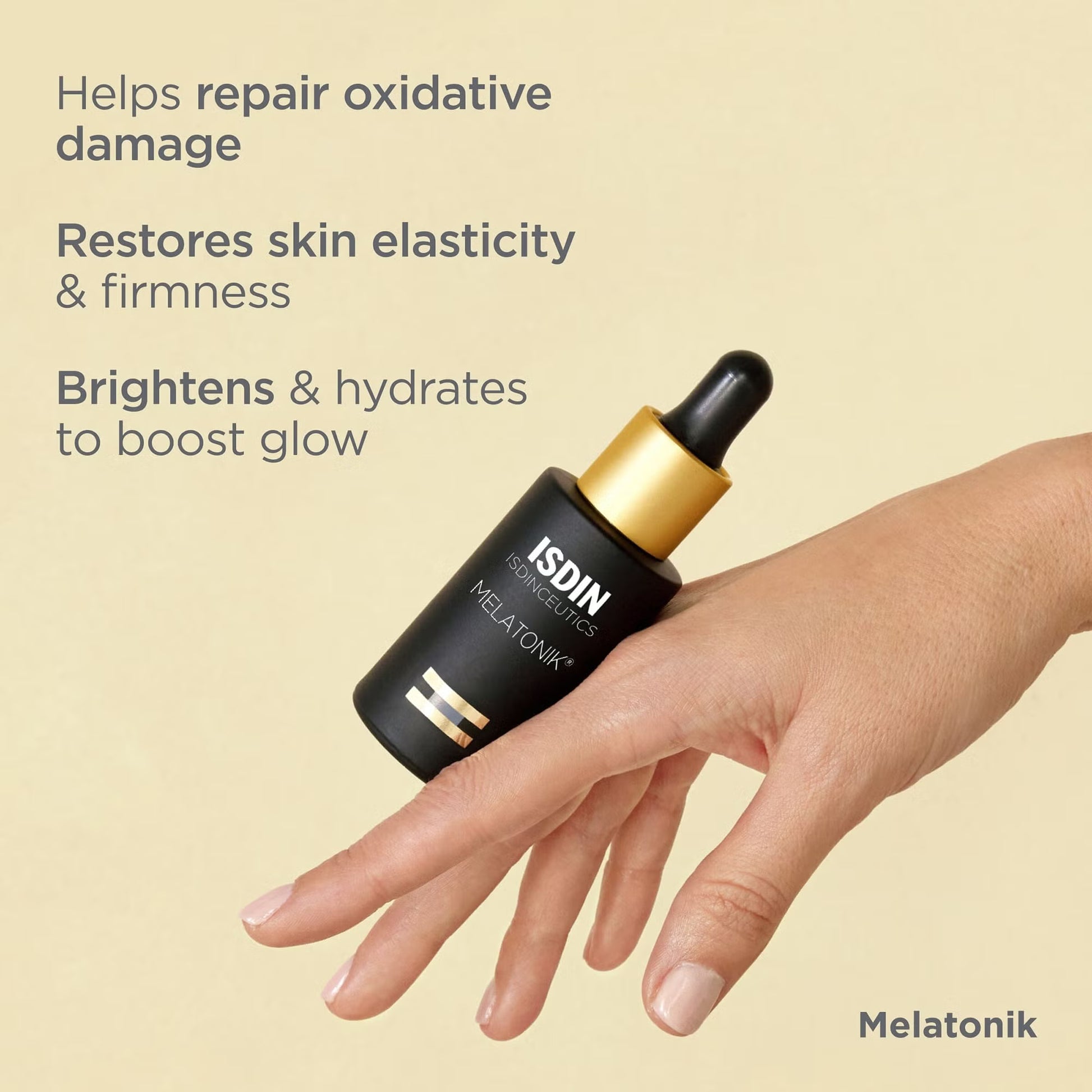 ISDIN Melatonik skincare serum bottle held by a hand on a beige background