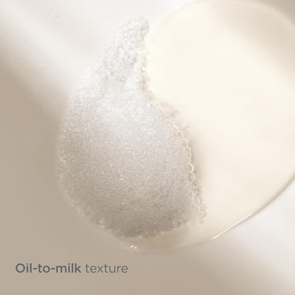 Oil-to-milk texture transition on a white background