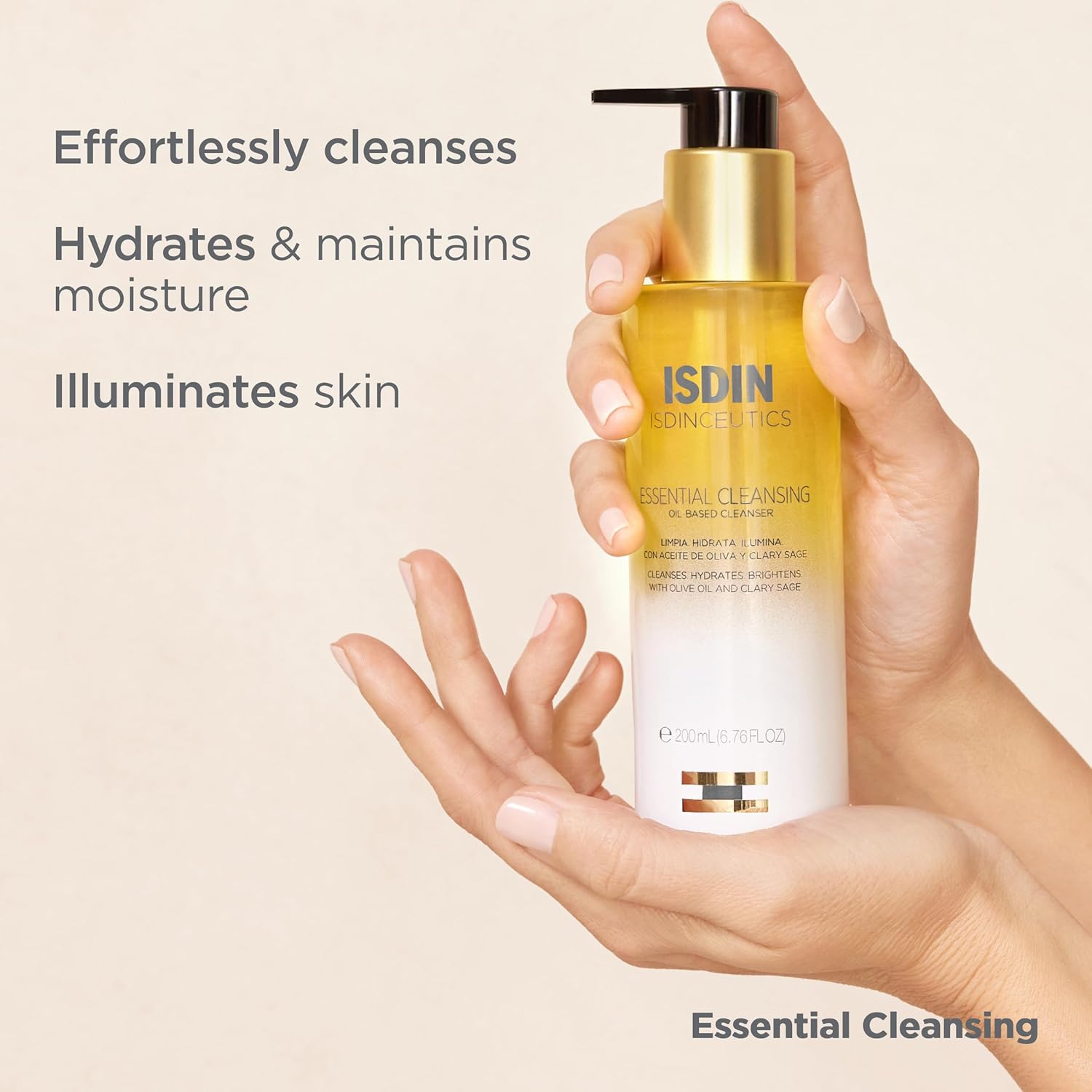 Hand holding a bottle of Isdin cosmetic product with text about skincare benefits on a beige background