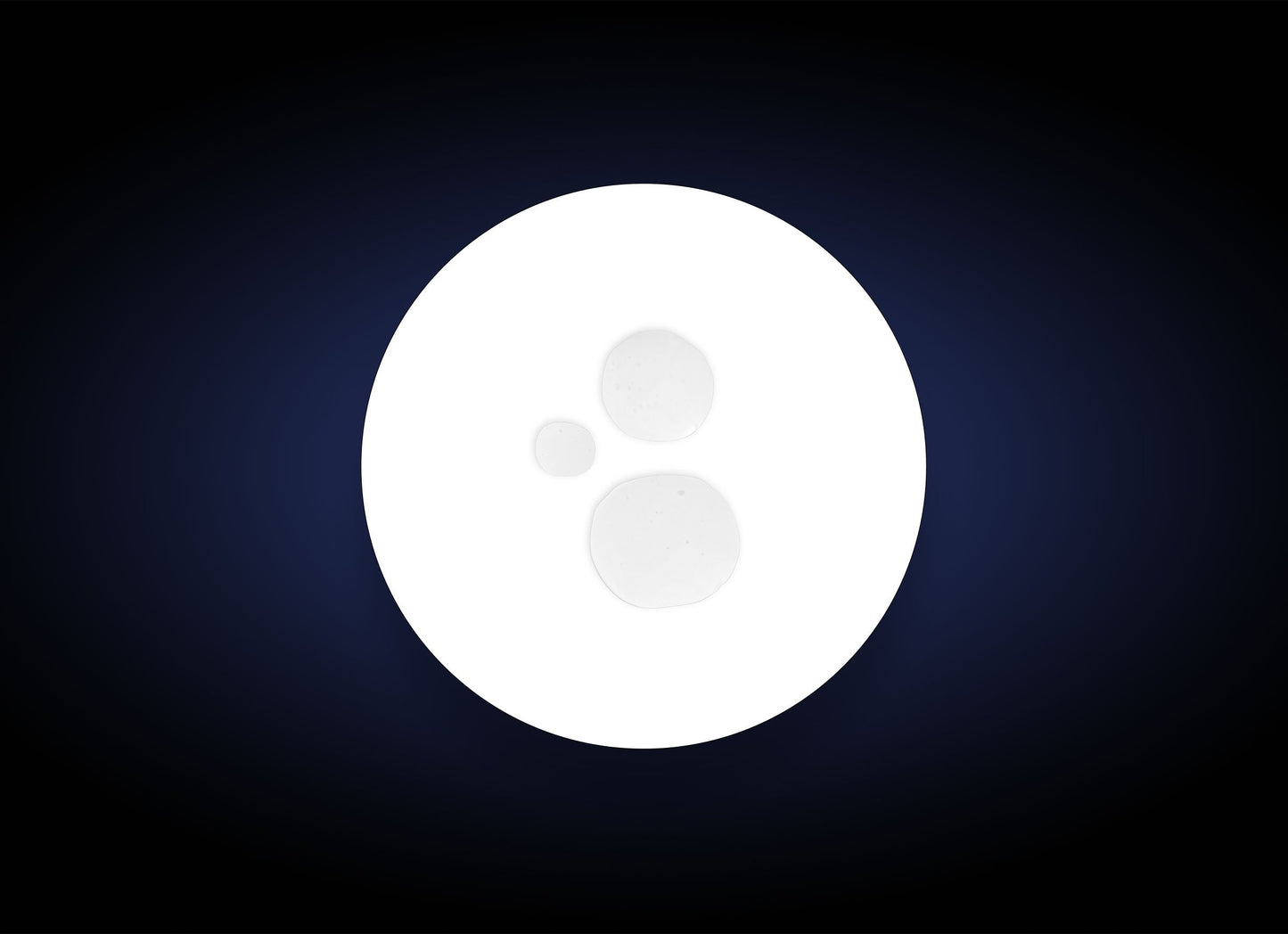 White circular object with a central dot on a dark blue background