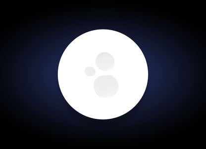 White circular object with a central dot on a dark blue background