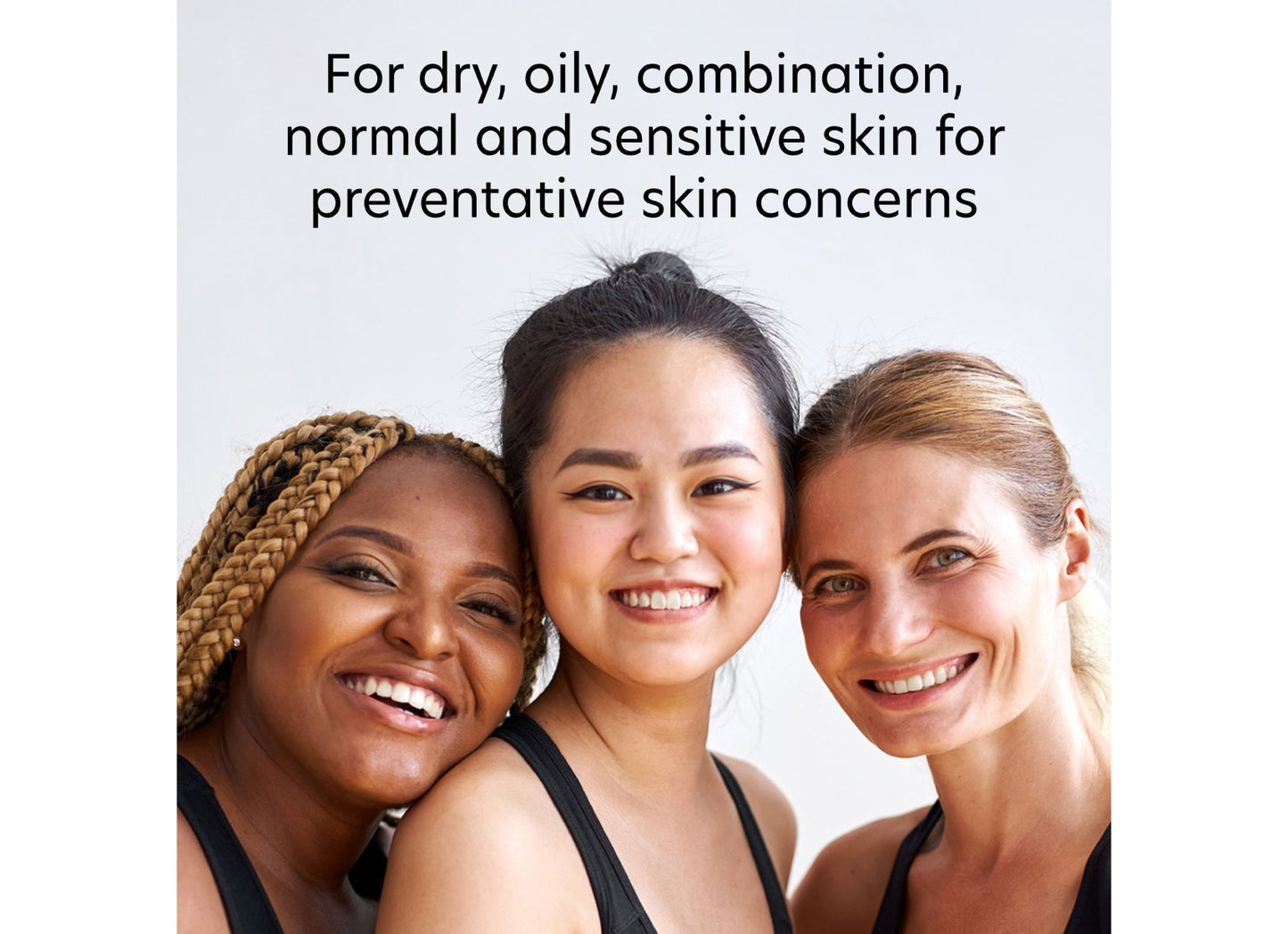Three women with different skin tones smiling together, with text about skin care.